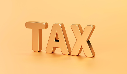 Gold TAX word of business financial concept or payment money taxes on economy background. 3D rendering.