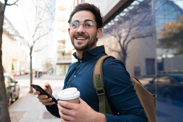 istock Young man using his mobile phone outdoors. 1307216294