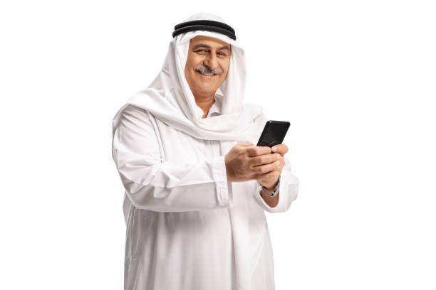 istock Mature arab man typing on a mobile phone 1307216797