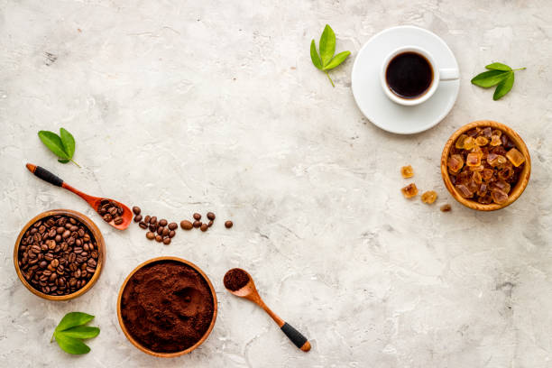 istock Espresso in white cup and coffee beans, top view. Coffee background 1307216885