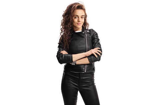Trendy female in a leather jacket posing isolated on white background