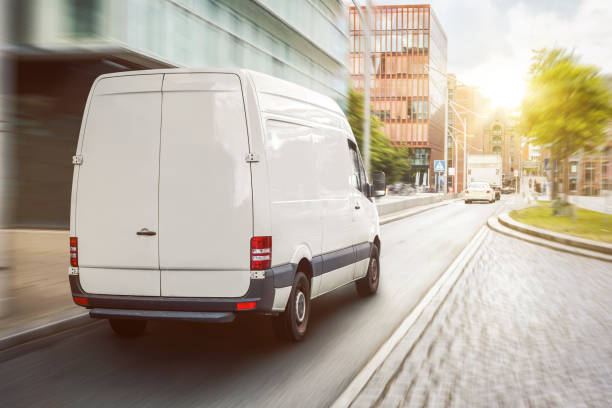 istock Cargo van driving in the city 1307217488