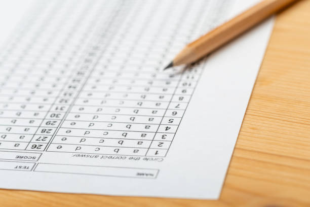istock testing in exercise and exam paper. computer sheet with pencil in school test room, education concept 1307217691