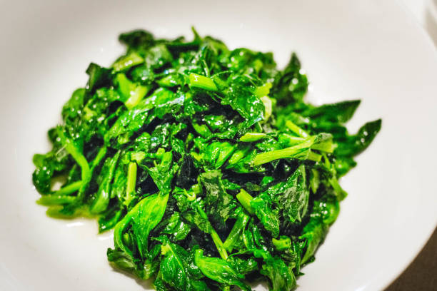 istock green vegetables stir fried chinese style and served in a white plate 1307218325