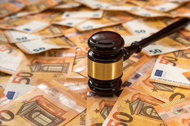 istock Judge hammer on 50 Euro banknotes background 1307219574