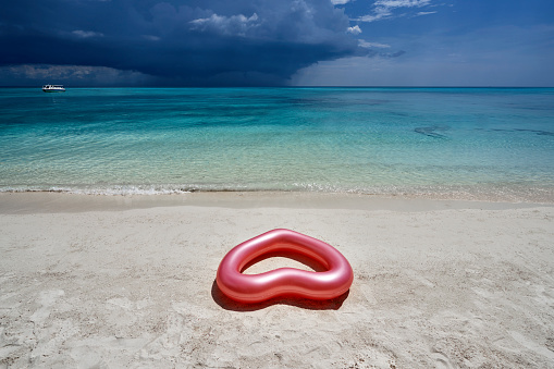 heart shaped life buoy on beach