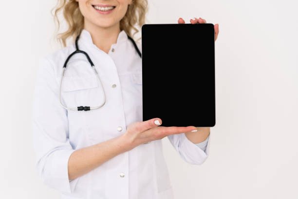 istock Doctor in white uniform against white background 1307223591