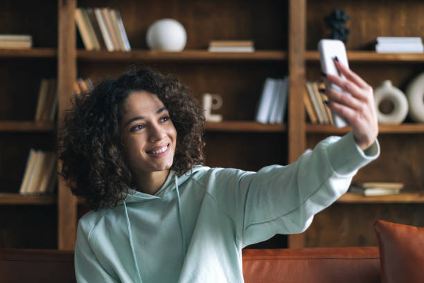 istock African american woman talking at video call 1307223823