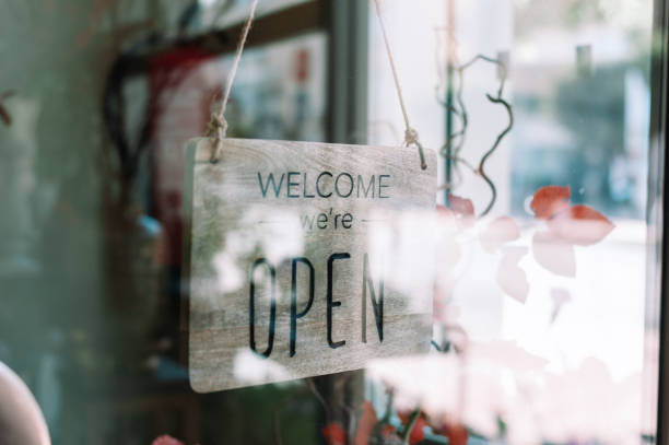 istock Welcome open sign at door 1307225019