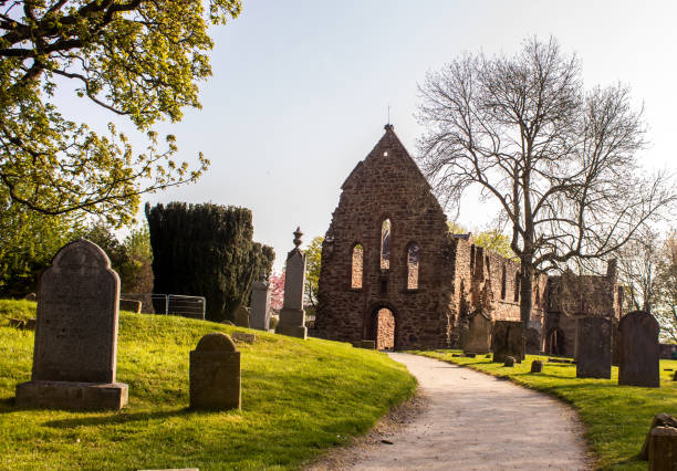 The ruins of the Beauly Priory, situated in the graveyard of the small town of Beauly in the Scottish Highlands, early on a clear sunny morning. This ruin of the priory is all that is left of a Monastery of the Monks of the Valliscaulian order. This was a French order and is also most likely were the name Beauly, which means Beautiful place in French, comes from.