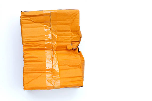 istock Damaged cardboard box with hole on white 1307226134