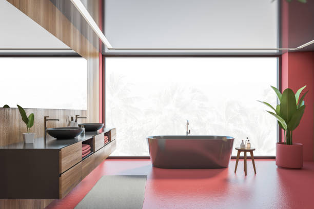 istock Wooden and red bathroom with black bathtub, sinks and window 1307226695