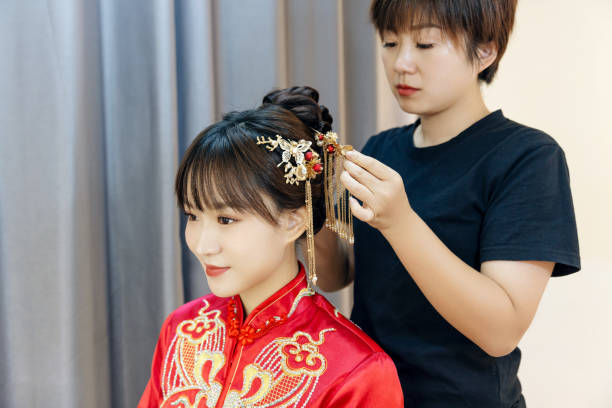the makeup artist made up the bride makeup artist applies makeup to a girl with different tools and cosmetics chinese wedding dress stock pictures, royalty-free photos & images