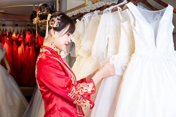 the makeup artist made up the bride makeup artist applies makeup to a girl with different tools and cosmetics chinese wedding dress stock pictures, royalty-free photos & images