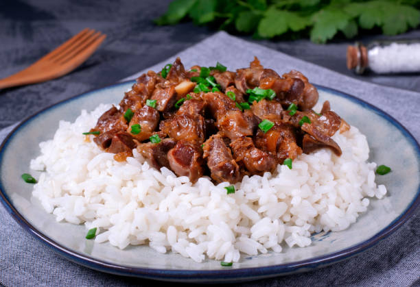istock Stewed chicken gizzards on the boiled rice 1307229823