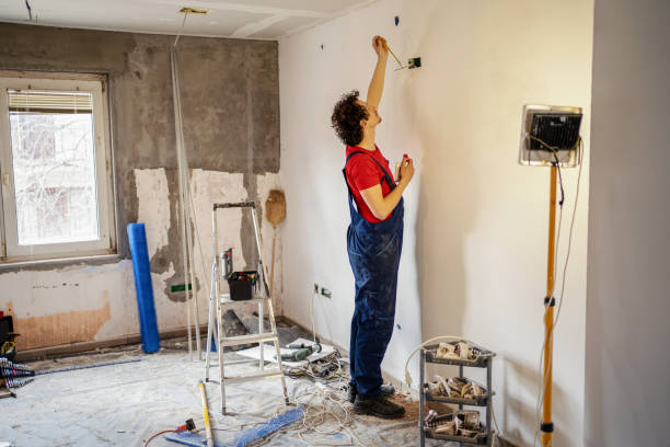istock An electrician fixing wires 1307230149