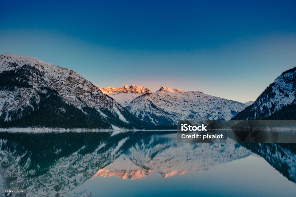 Ammerwald Plansee golden-hour Mountain landscape Plansee lake in Austrian Alps. Landscape Mountain sunset shoot Austria, Europe. Lake Stock Photo