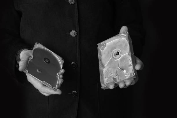 istock A man holds an empty opened hard disk in his hands. Identity theft or corporate secret concept 1307231066