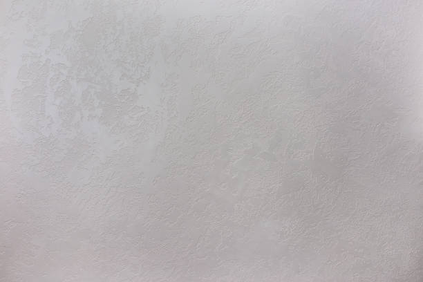 istock Texture of a grey stone decorative plaster or concrete wall. 1307231223