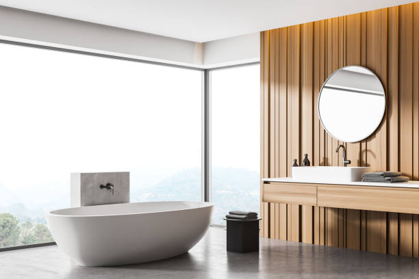 istock Wooden bathroom interior with a white tub, double sinks and round mirrors. mock up 1307231245