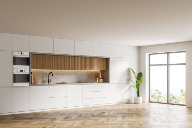 istock Stylish white and wooden kitchen corner with cupboards 1307231259