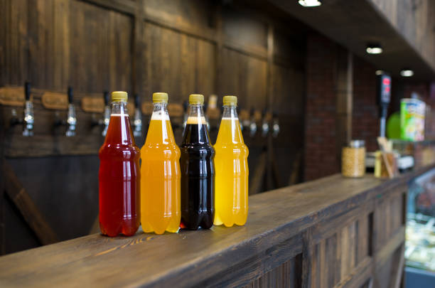 istock plastic bottles of light and dark beer on a pub counter. Beer background 1307237152