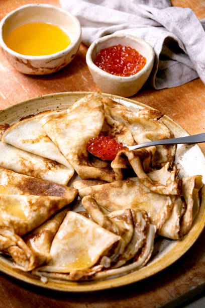 istock Thin pansakes with red caviar and butter 1307237990