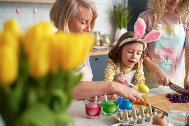 istock Happy family preparation natural dyes for coloring eggs 1307238634