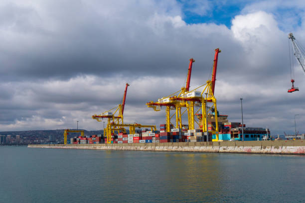February 28, 2021 Russia, Novorossiysk. Port cranes for loading containers onto ships.
