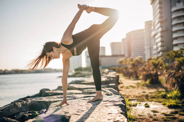istock Female doing yoga by the sea 1307243714