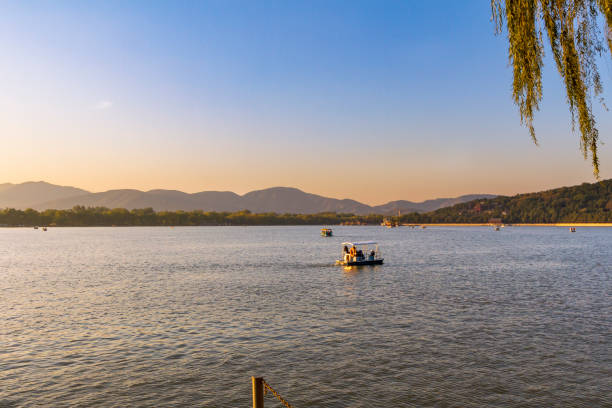 Pedal boat at the Kunming Lake, Beijing’s Summer Palace, at sunset