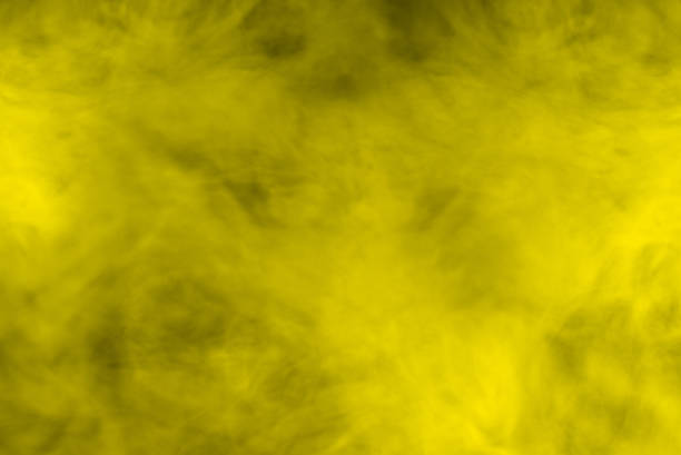 istock Yellow steam on a black background. 1307244328