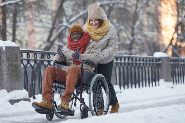 istock Wheelchair User Having Fun in Winter 1307244410