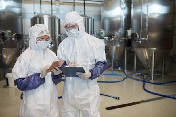 istock Two Chemical Plant Workers Controlling Production 1307245460