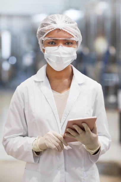 istock Young Female Worker at Pharmaceutical Factory 1307245468