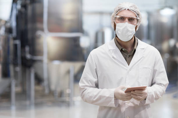 istock Male Worker at Pharmaceutical Factory 1307245477