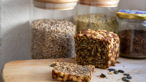istock Loaf of seed nad nut bread and a cut slice. 1307245724