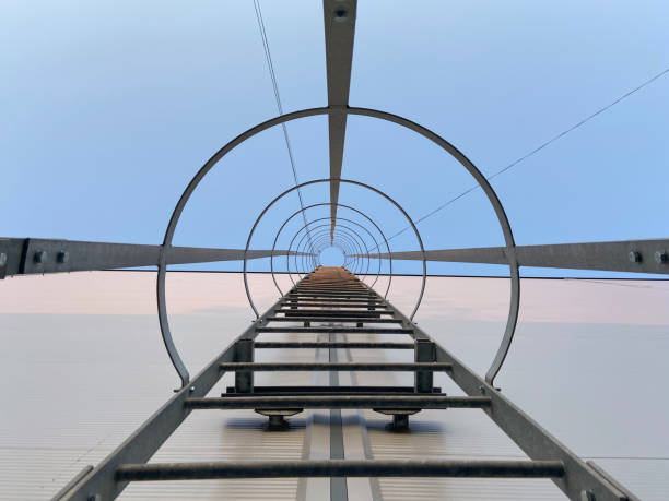 istock View of metallic ladder against blue sky 1307245891