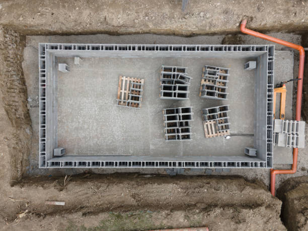 istock Drones aerial photo of a construction site for a pool, concrete blocks already coated and bricked up with construction adhesive
