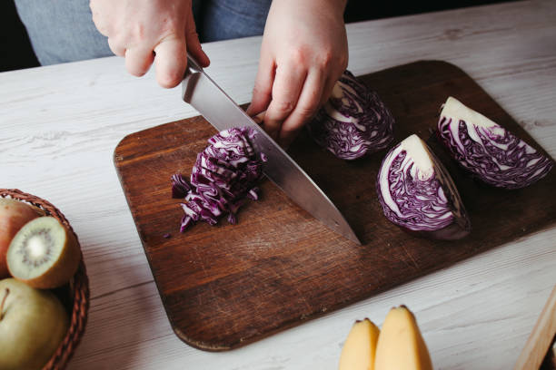 istock Female hands making healthy fresh vegetable salad 1307250291