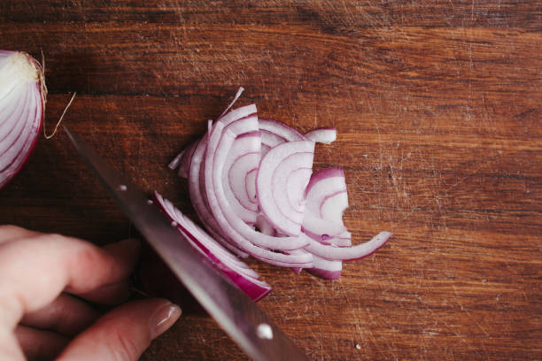 istock Female hands making healthy fresh vegetable salad 1307250311
