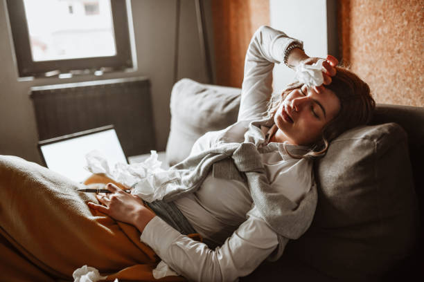 istock Covid- 19 Infected Female Falling Asleep While Trying To Study 1307251417