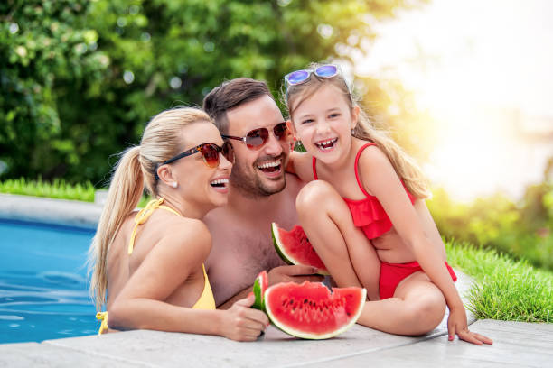 istock Happy young family enjoying on vacation 1307251609