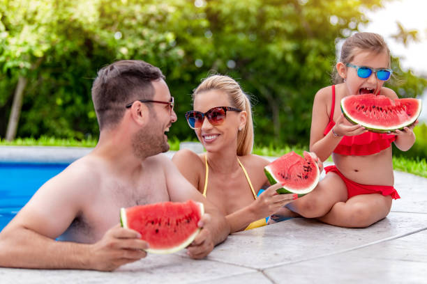istock Happy young family enjoying on vacation 1307253309