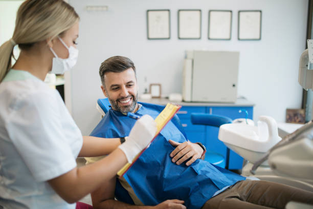 istock Young handsome Caucasian man visiting his dentist 1307254329