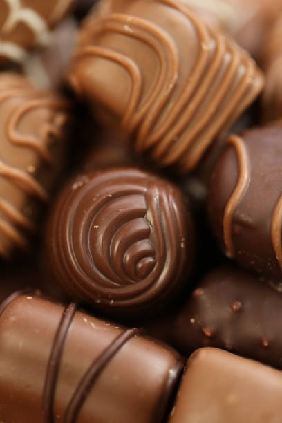 istock Chocolates assortment set.Chocolate sweets.Chocolate pattern. Candy close-up .dark milk chocolates set.Set of different chocolates.Sweet dessert 1307254514