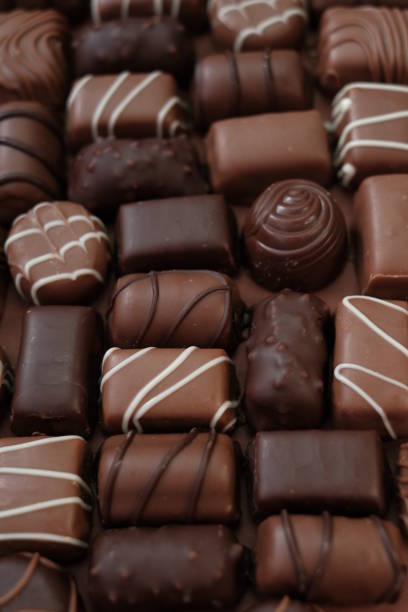 istock Chocolates assortment set.Chocolate sweets.Chocolate pattern. Candy close-up .dark chocolates set.Set of different chocolates.Sweet dessert 1307254529