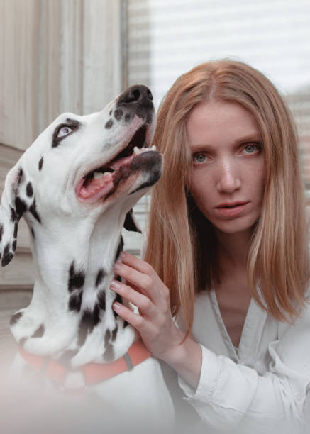 istock A young woman with her dalmatian dog 1307254766