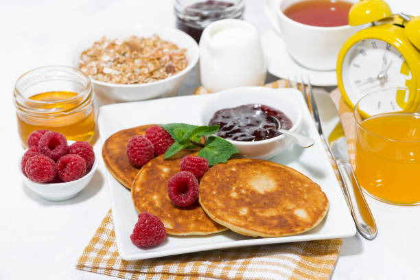 istock delicious pancakes with fresh raspberries and jam for breakfast 1307254804