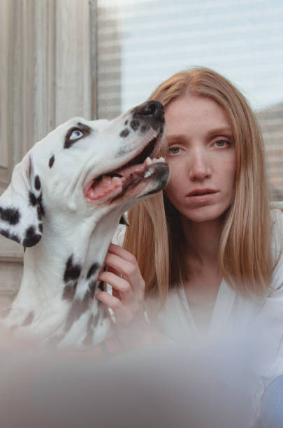 istock A young woman with her dalmatian dog 1307254806